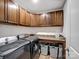 Laundry room featuring modern washer and dryer and storage cabinets with ample counter space at 8137 Bryson Rd, Fort Mill, SC 29707
