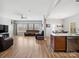 Spacious open-concept living room and dining area with hardwood floors, neutral walls, and large windows for natural light at 8137 Bryson Rd, Fort Mill, SC 29707