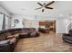 Open-concept living room with hardwood floors flowing into the kitchen and dining areas at 8137 Bryson Rd, Fort Mill, SC 29707