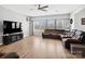 Comfortable living room features hardwood floors, a large sectional sofa, and ample natural light at 8137 Bryson Rd, Fort Mill, SC 29707
