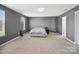 Spacious main bedroom with large window and neutral carpet, bathed in natural light at 8137 Bryson Rd, Fort Mill, SC 29707