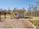 Outdoor shed providing extra storage space, surrounded by landscaping and greenery at 8137 Bryson Rd, Fort Mill, SC 29707