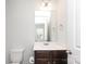 Bathroom featuring brown vanity with sink, mirror, and white walls at 8232 Waxhaw Hwy, Waxhaw, NC 29173