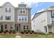 Attractive multi-level townhouse features brick accents, manicured landscaping, and welcoming front entrance at 8232 Waxhaw Hwy, Waxhaw, NC 29173