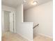 Bright hallway with carpeted floor leading to the staircase at 8232 Waxhaw Hwy, Waxhaw, NC 29173