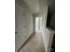 Upstairs hallway with carpet and doors, providing access to other areas at 8232 Waxhaw Hwy, Waxhaw, NC 29173