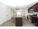 Modern kitchen with granite countertops, stainless steel appliances, and a center island, perfect for cooking and entertaining at 8232 Waxhaw Hwy, Waxhaw, NC 29173