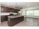 Stylish kitchen featuring stainless steel appliances, a large island with seating, and ample cabinet space at 8232 Waxhaw Hwy, Waxhaw, NC 29173