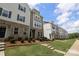 A row of townhomes showcasing their exteriors, complete with landscaping and inviting entrances at 8232 Waxhaw Hwy, Waxhaw, NC 29173