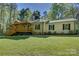 Charming single-story home with a large wooden porch and well-manicured lawn at 8322 Loma Linda Ln, Waxhaw, NC 28173