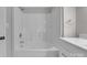 Bright bathroom features a shower-tub combo, modern fixtures, and vanity at 1034 Marietta St, Charlotte, NC 28214