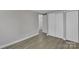 This bedroom features new floors, white trim and multiple closets at 1034 Marietta St, Charlotte, NC 28214