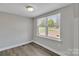 Bright bedroom featuring neutral paint, recessed lighting, modern flooring, and large window at 1034 Marietta St, Charlotte, NC 28214
