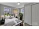 Cozy bedroom featuring wood flooring, large closet, and bright window at 1034 Marietta St, Charlotte, NC 28214