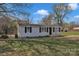 Charming one-story home with front porch, black shutters, and a well-maintained lawn at 1034 Marietta St, Charlotte, NC 28214