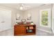 Bedroom featuring a custom wood desk, natural light, and neutral walls at 10602 Country Squire Ct, Matthews, NC 28105