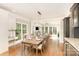 Inviting dining room with hardwood floors, bright windows and modern decor at 10602 Country Squire Ct, Matthews, NC 28105