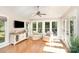 Bright living area featuring hardwood floors, neutral furniture and large windows at 10602 Country Squire Ct, Matthews, NC 28105