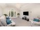 Spacious living room featuring an arched window, recessed lighting, and cozy seating at 10602 Country Squire Ct, Matthews, NC 28105