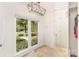 Functional mudroom with large window and tile floors for easy maintenance at 10602 Country Squire Ct, Matthews, NC 28105