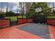 Backyard features a deck area with painted black accents and a basketball court at 10928 Jardin Way, Charlotte, NC 28215