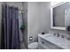 Modern bathroom featuring sleek tile, shower, and a vanity with a white countertop and stylish fixtures at 10928 Jardin Way, Charlotte, NC 28215