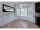 Cozy dining area features bright windows, a modern light fixture, and access to the kitchen at 10928 Jardin Way, Charlotte, NC 28215