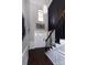 Open foyer with soaring ceilings, dark floors, designer lighting, and large windows providing lots of natural light at 10928 Jardin Way, Charlotte, NC 28215