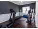 Well-equipped home gym with a treadmill, exercise bike, and other fitness gear at 10928 Jardin Way, Charlotte, NC 28215