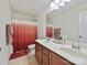 Bathroom featuring a double sink vanity, a toilet, and a shower with a colorful curtain at 11621 Red Knoll Ln, Pineville, NC 28134