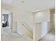 Upstairs hallway featuring neutral carpeting, paint and trim at 11621 Red Knoll Ln, Pineville, NC 28134