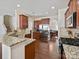 Open kitchen featuring stainless steel appliances, granite countertops, and wood cabinets at 11621 Red Knoll Ln, Pineville, NC 28134