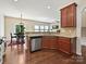 Bright and spacious kitchen with wood cabinets, stainless steel appliances, and an open layout at 11621 Red Knoll Ln, Pineville, NC 28134