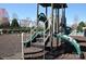 Community playground featuring a jungle gym and a swing set, surrounded by lush greenery, offering a fun and safe environment at 11621 Red Knoll Ln, Pineville, NC 28134