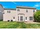 Rear exterior of home featuring well-maintained lawn and patio at 119 Tilton Dr, Mooresville, NC 28115