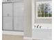 Bathroom featuring a sleek glass-door shower and tub at 119 Tilton Dr, Mooresville, NC 28115
