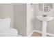 Bathroom with white toilet and modern pedestal sink at 119 Tilton Dr, Mooresville, NC 28115