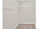 Walk-in closet with carpet and wire shelving for easy organization at 119 Tilton Dr, Mooresville, NC 28115