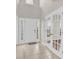 Bright foyer with tile flooring and transom windows with a beautiful front door at 119 Tilton Dr, Mooresville, NC 28115