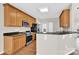 Kitchen showcases wood cabinetry, granite counters, and stainless appliances at 119 Tilton Dr, Mooresville, NC 28115