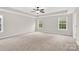 Large main bedroom with neutral carpet, ceiling fan, and recessed lighting at 119 Tilton Dr, Mooresville, NC 28115