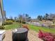Spacious backyard featuring a patio, landscaping, and well-maintained lawn at 121 Hanks Bluff Dr, Mooresville, NC 28117