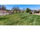 A beautifully maintained backyard featuring lush green grass and a secure black metal fence at 121 Hanks Bluff Dr, Mooresville, NC 28117