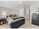 Comfortable bedroom featuring a queen bed, soft carpet, and ample natural light at 121 Hanks Bluff Dr, Mooresville, NC 28117