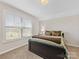Sunlit bedroom featuring a large window and cozy bedding at 121 Hanks Bluff Dr, Mooresville, NC 28117