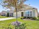 Well-maintained home with a two-car garage, lush lawn, and mature tree at 121 Hanks Bluff Dr, Mooresville, NC 28117