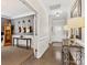 Spacious hallway featuring hardwood floors and decorative guitars on a dark gray wall at 121 Hanks Bluff Dr, Mooresville, NC 28117