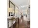 Hallway with hardwood floors leads to bright, inviting living spaces at 121 Hanks Bluff Dr, Mooresville, NC 28117