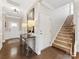 Inviting entryway featuring hardwood floors, staircase, and stylish decor elements at 121 Hanks Bluff Dr, Mooresville, NC 28117
