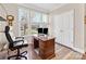 Cozy home office featuring a wooden desk, ample natural light, and neutral tones at 121 Hanks Bluff Dr, Mooresville, NC 28117